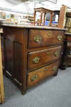 A 19th century Continental elm three drawer chest.