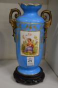 A Sevres style vase on associated stand.