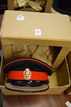 Queens regiment, a dress cap and khaki cap, both with badges and original boxes.