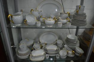 A comprehensive Clarice Cliff dinner and coffee service, grey ground with gilt decorated rims.