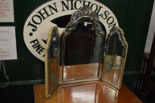 A Venetian style dressing table mirror.