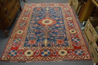 A good Persian design rug, rich blue ground with stylised decoration, 240cm x 180cm.