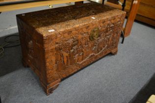 A Chinese carved camphor wood coffer.
