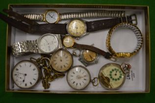 A collection of silver pocket watches and wristwatches.