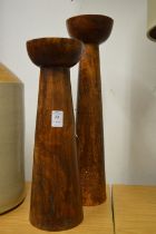 Two turned wood candle stands.