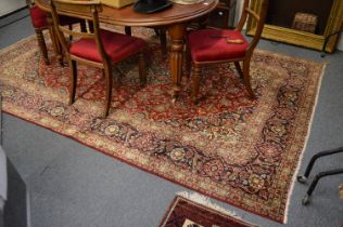 A good Persian design carpet, red ground with allover stylised floral decoration, 295cm x 200cm.