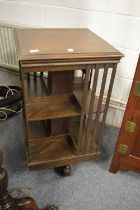 An oak revolving bookcase.