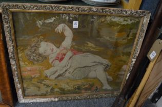 Gilt framed tapestry picture depicting a reclining figure.