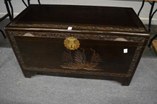 A Chinese carved camphor wood coffer.