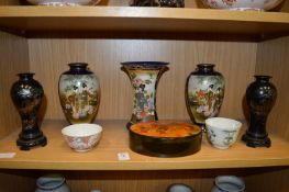 A pair of Japanese Satsuma vases, similar vase and other items.