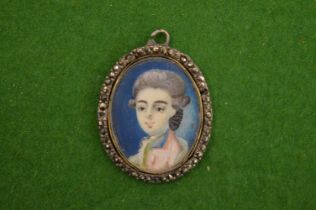 A portrait miniature pendant.