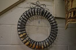 An unusual wrought iron wall mounted egg holder.