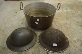 Copper preserve pan and two old tin helmets.