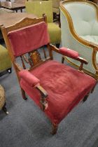 A Victorian inlaid rosewood open armchair.
