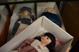 Three large boxed collectors dolls.