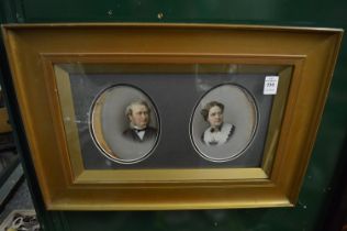 A pair of oval painted porcelain panels depicting Mr & Mrs Fleming of Liverpool, framed and glazed.