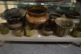 A collection of Eastern copper and brass bowls, jardinieres etc.