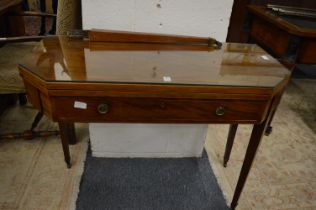 A George III mahogany tea table with shaped rectangular top, single frieze drawer on tapering