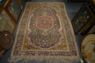 Persian rug, beige and blue ground with allover floral decoration (worn), 190cm x 135cm.