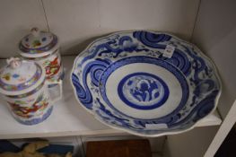 Chinese blue and white dish together with a pair of modern Chinese lidded tankards.