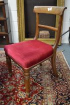 A set of four Victorian mahogany dining chairs with turned and reeded legs.