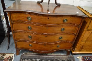 A good George III mahogany serpentine fronted four drawer chest.