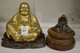 Two brass Buddha's on stands.