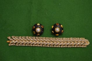 Decorative gilt metal bracelet, signed and a pair of stylish ear clips.