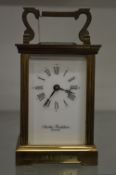 Charles Frodsham, a brass carriage clock.