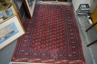 A Persian design Bokhara rug with three rows of fifteen gulls, 188cm x 130cm.