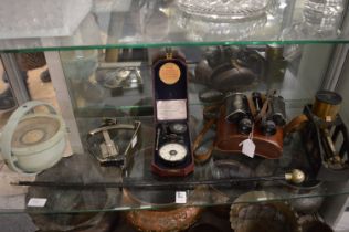 Military related items to include a leather cased pair of binoculars, surveying instruments etc.