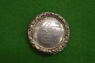 An early 19th century silver circular vinaigrette with various engraved inscriptions.
