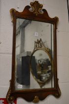 A George III design gilt decorated mahogany fretwork framed mirror.