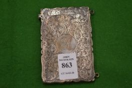 An engraved silver calling card case.