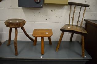 Two rustic stools and a similar small chair.