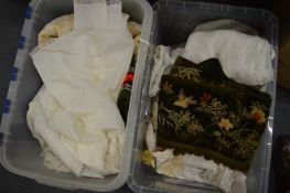 Two boxes of linen, lace and textiles.