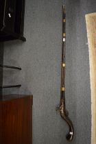 Early 19th century flintlock rifle with curving stock, the lock plate stamped 1809.