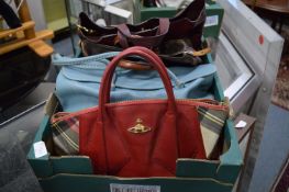 A collection of ladies designer handbags.