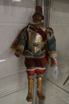 An unusual Continental carved wood and painted figure with traditional costume.