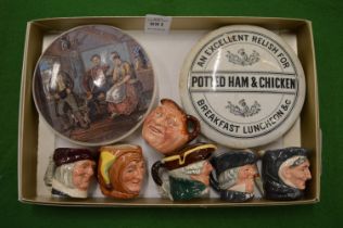 Two pot lids and six miniature Doulton toby jugs.