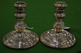 A pair silver candlesticks.