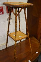 A small bamboo two-tier occasional table.