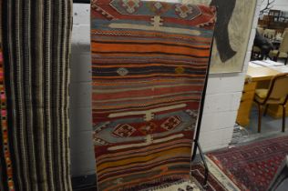 A Kilim carpet, 297cm x 95cm.