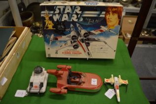 Star Wars, An X-Wing Fighter, A Kenner Landspeeder, and a Mobile Laser Canon, all unboxed, togethe