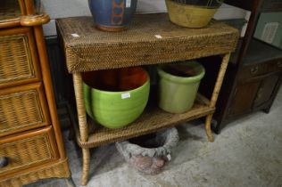 A rattan two-tier table.