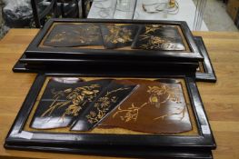 A group of seven carved and gilt decorated Chinese wooden panels.