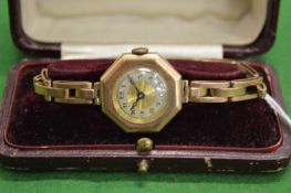 J W Benson, a ladies 9ct gold wristwatch with expanding bracelet.