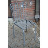 A wrought iron chair.