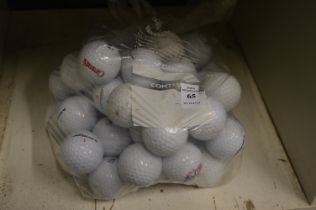 A bag of fifty Dunlop golf balls.