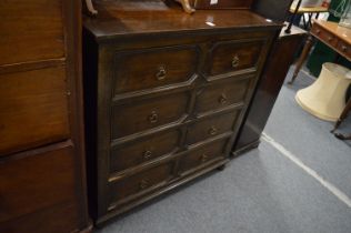 An 18th century style oak chest of drawers.